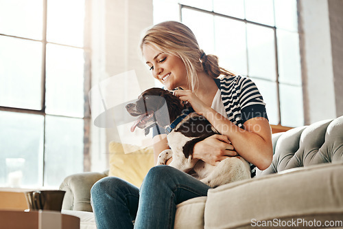 Image of Woman, dog and calm smile on sofa in living room for animal care, love and support in home. Young female, pet care and relax peace on couch, playful and happiness lifestyle together with therapy dog