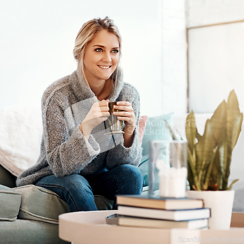 Image of Woman relax in living room, coffee and smile, peace on sofa and content at home with lifestyle and happiness. Female in apartment, happy woman and coffee cup, positive energy and wellness mindset