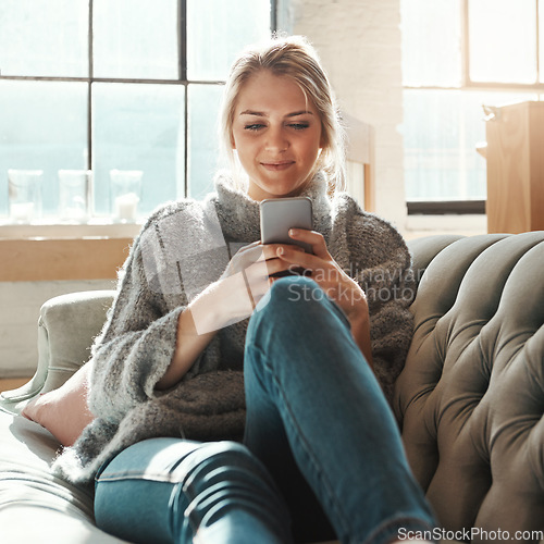 Image of Woman, sofa and smartphone on social media, reading or communication on internet to relax in lounge. Girl, couch and chat with phone, mobile tech or online dating for partner, love or romance in home