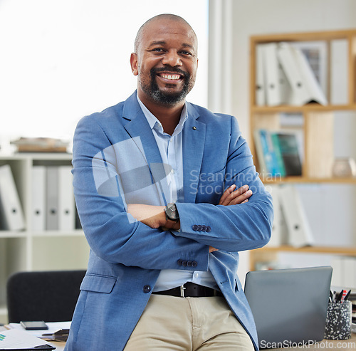 Image of Accountant portrait and corporate black man in office with confidence, pride and smile in workspace. Mature employee in professional accounting company with arms crossed and optimistic mindset.