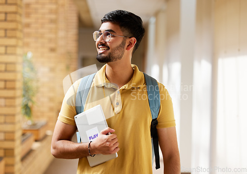 Image of University student, college and indian man with a tablet and backpack while walking down campus corridor. Young gen z male happy about education, learning and future after studying at school building