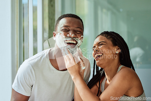Image of Skincare wellness, happy couple in bathroom and shaving face with product for facial treatment. Laughing together in home, natural beauty and funny girlfriend helping black man with cream application