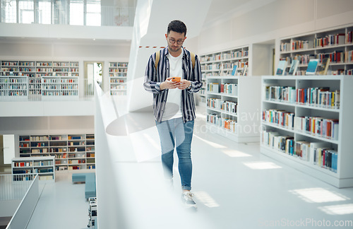 Image of Student walking in library with phone for university, education or college website, internet search and academy faq, about us or contact. Campus, cellphone and teenager reading scholarship newsletter