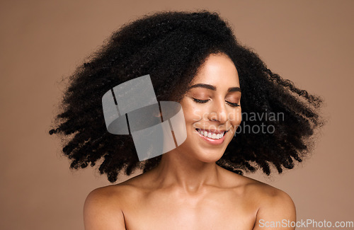 Image of Shake hair, afro and face of black woman with clean shampoo hair care, luxury skincare cosmetics and natural facial makeup. Spa salon, trichology and happy African model with aesthetic healthy hair