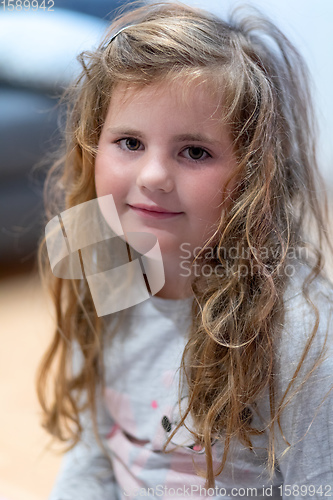 Image of little Caucasian girl child with disheveled hair