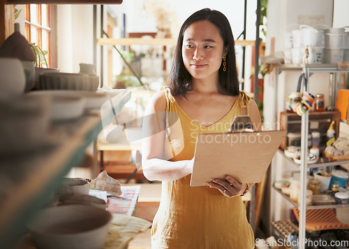 Image of Kitchen stock checking, Asian woman and clipboard data of a entrepreneur check store information. Happy, smile and startup worker busy working on a ingredient inventory search for accounting audit