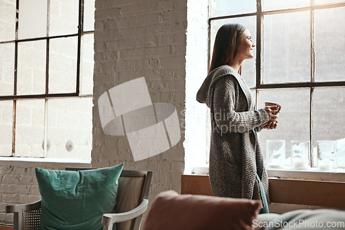 Image of Relax, coffee and woman looking out window from her home, thinking and daydreaming on a quiet morning. Daydream, tea and girl staring, contemplating and resting in her her living room on the weekend