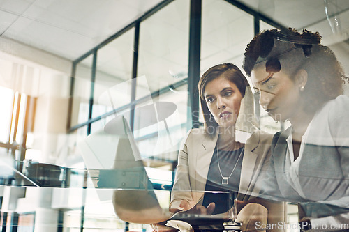 Image of Business people, laptop and meeting conversation planning tech strategy, online marketing or teamwork collaboration. Corporate women, web design and ux designers talking with digital device in office