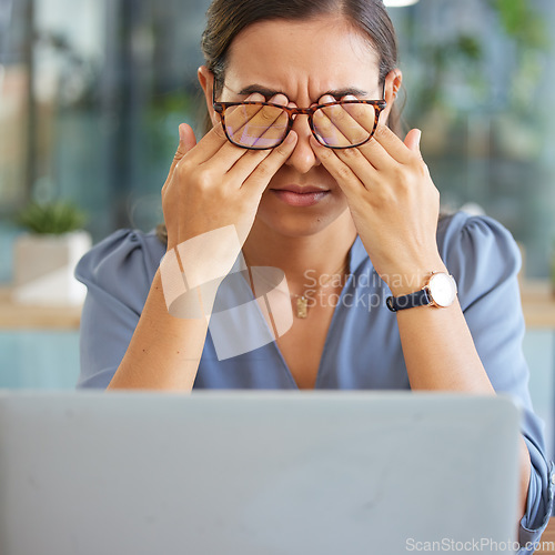 Image of Tired corporate woman, laptop and eye pain with hands, glasses and stress at desk in finance office. Burnout, executive leader and headache by computer with mental health, problem or anxiety in Dubai
