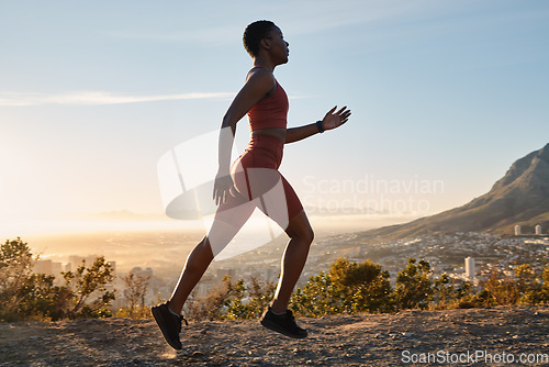 Image of Running, mountain and black woman athlete for fitness, workout or speed in morning sunrise. Nature training, run and runner for cardio exercise, performance or summer sunshine by mountains trail road