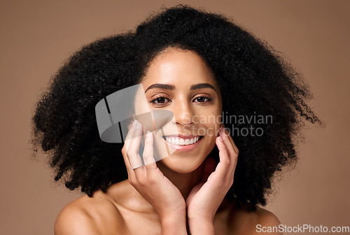 Image of Black woman, portrait and smile with beauty, hands and cosmetic health with makeup, face or natural hair. Model, skin glow and facial cosmetics for self care, happy or afro by brown studio background