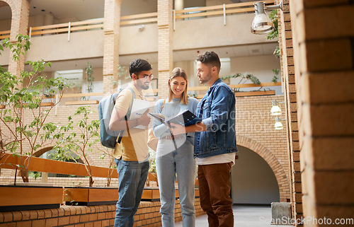 Image of University, students and friends with study book for project, education or sharing information together at the campus. Group of college people reading textbook with smile for learning or scholarship