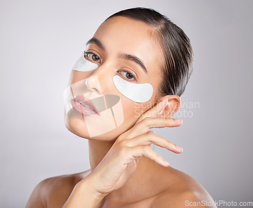 Image of Skincare, eye patch and portrait of woman with beauty product for self care, anti aging and wellness. Facial healthcare, spa salon and aesthetic model face with makeup cosmetics on studio background