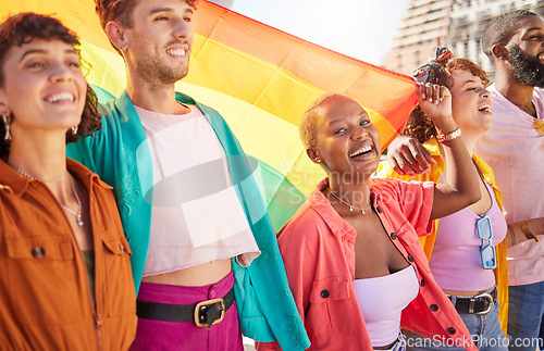 Image of Friends, city and lgbt people walking with rainbow flag for support, queer celebration and parade for solidarity. Diversity, lgbtq community and group enjoy freedom, happiness and pride identity