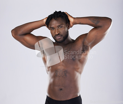 Image of Sexy body, fitness and black man portrait for sports person in studio for strong muscle and power. Health and wellness of a male bodybuilder model with growth after exercise, workout and training