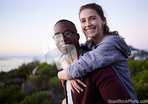 Image of Love, nature and portrait of interracial couple on mountain for holiday, vacation and adventure on weekend together. Travel, dating and happy man piggyback woman enjoy calm, outdoor freedom and peace