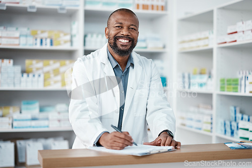 Image of Pharmacy, portrait and black man with clipboard, medicine and pill prescription. African American male, pharmacist and medical professional writing, make notes for stock and inventory for healthcare.