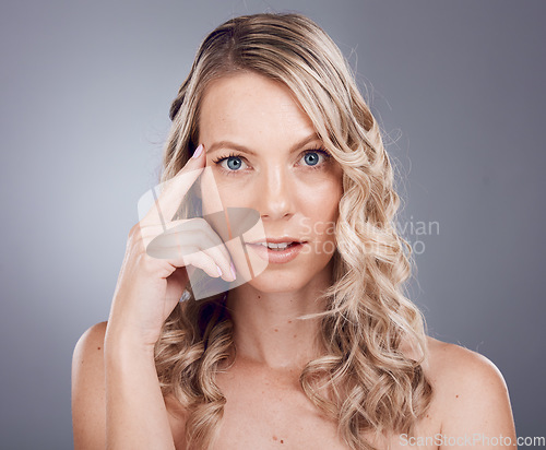 Image of Face portrait, beauty skincare and woman in studio isolated on a gray background. Makeup, cosmetics and aesthetics of female model with healthy, glowing and flawless skin after spa facial treatment