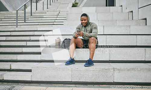 Image of Social media, phone or black man on steps after fitness training, exercise or workout with a sports bag in Miami, Florida. Social networking, happy or healthy athlete texting, chat or typing online