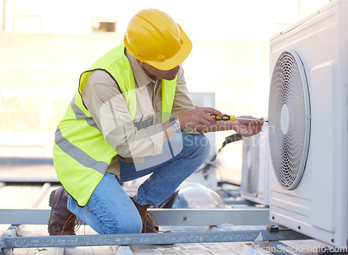 Image of Air conditioning, technician or engineer on roof for maintenance, building or construction of fan hvac repair. Air conditioner, handyman or worker with tools working on a city development project job