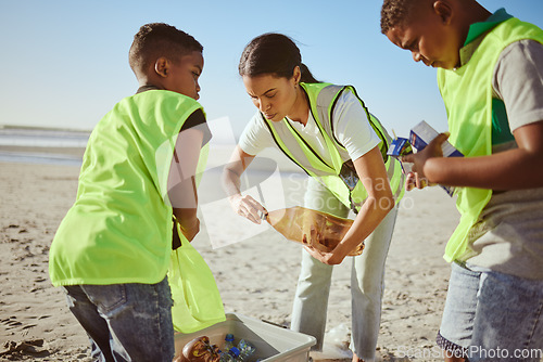 Image of Plastic bottle, beach and woman with children recycling, cleaning and learning, education and community for pollution. Mother or teacher with kids and recycling teamwork, project goals and earth day