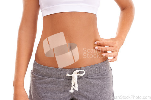 Image of Diet, health and woman pinch stomach after weight loss, body transformation or liposuction on white background studio. Wellness lifestyle, cellulite or abdomen of healthcare girl with fitness results