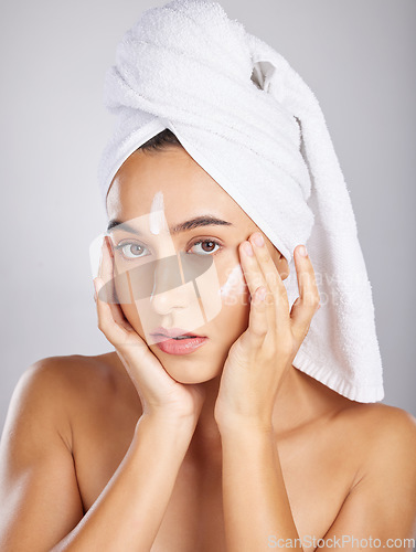 Image of Skincare, woman model and face portrait with facial moisturizer and spa cream in morning. Towel, sunscreen and skin wellness care of a young person with cosmetic, collagen and dermatology product