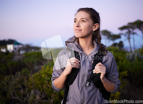 Image of Woman, hiker and backpacking in nature travel for sightseeing or adventure in the outdoors. Happy female tourist carrying bag, hiking or trekking in journey, trip or traveling for healthy wellness