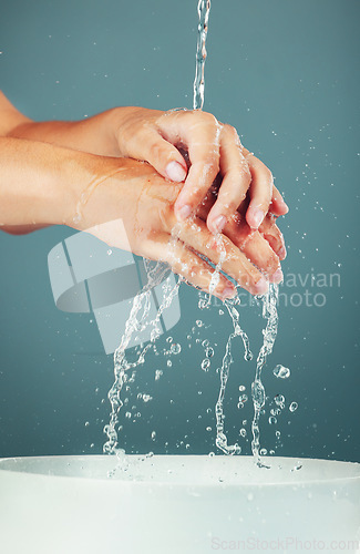 Image of Woman, water and washing hand zoom isolated on studio background, hygiene and skincare with beauty. Health, wellness and liquid splash, natural cosmetics and body, shower and cleaning hands