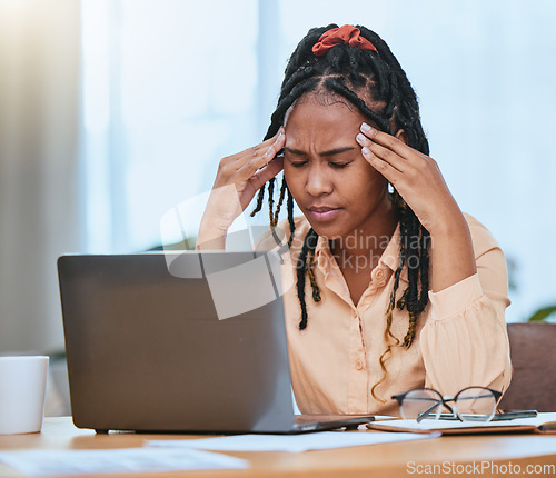 Image of Black woman, headache and stress with laptop while tired in home office of studying or working. Entrepreneur person tired, burnout and exhausted with fatigue for remote work and startup business