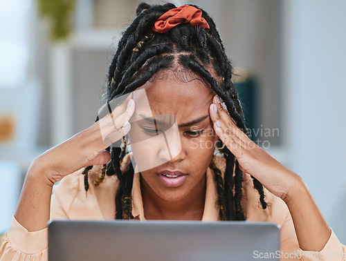 Image of Black woman, headache and stress with laptop glitch while depressed in home office. Entrepreneur person tired, burnout and fatigue with bad mental health for remote work and startup business