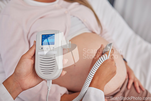 Image of Pregnant, woman and doctor hands with heart monitor for baby healthcare, medical support or hospital gynecology. Pregnancy maternity consultation, patient stomach and gynecologist with fetal doppler