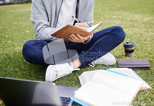 Image of Study, laptop and student in park writing at university, college or campus for education research, planning schedule or scholarship. Relax person on grass learning on technology and notebook for exam