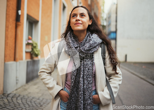 Image of Travel, walking and woman in the city street for adventure, thinking and exploring on holiday in France. Smile, peace and girl on a walk in the road during a vacation to relax while traveling