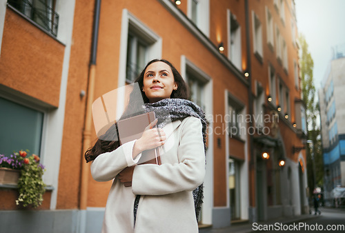 Image of Business woman, tablet and thinking in the city of a freelance travel writer by buildings. Writing idea, technology and worker by a urban building with a happy smile about holiday traveling for work