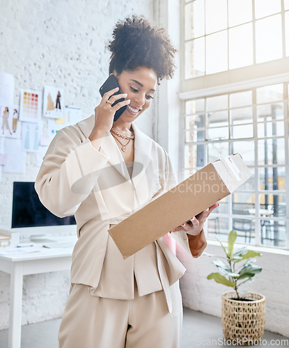 Image of Package, phone call and logistics woman or small business owner talking to courier services, ecommerce and fashion. Product supplier, box and fashion black person with shipping stock for online order