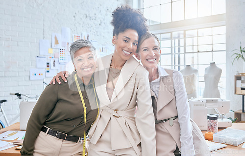 Image of Fashion designer, team and portrait in workshop, smile and happy about startup or small business. Face, group and female partners excited for success, design studio and creative manufacturing company