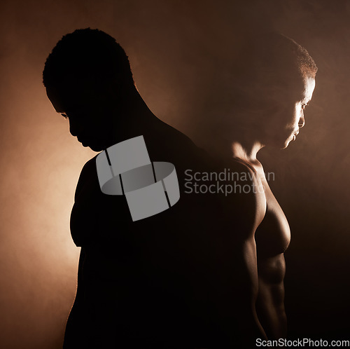 Image of Black man, dark studio and muscle silhouette reflection with thinking, depression and mental health with shadow. Man, art aesthetic and smoke with strong body, alone and struggle with anxiety problem