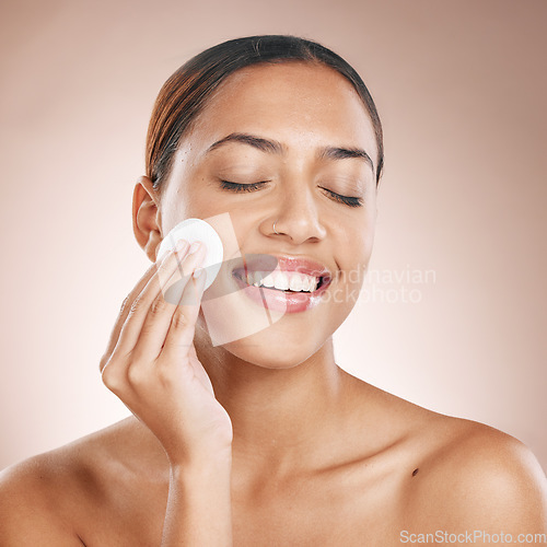 Image of Beauty, woman and cotton pad with face and facial treatment, wellness and happy cleaning with skincare mockup. Skin, natural cosmetics and makeup removal, cosmetic care against studio background