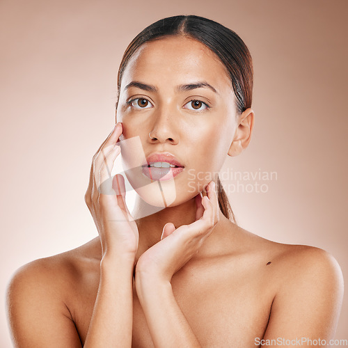 Image of Skincare, beauty and portrait of woman with glowing skin and on studio background in Atlanta. Makeup, glamour and luxury care with hands on face and natural cosmetics for detox facial on black woman.