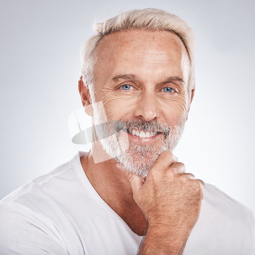 Image of Face portrait, thinking and senior man in studio isolated on a gray background. Skincare, cosmetics and retired, elderly and happy male model contemplating ideas for beauty, grooming and wellness.
