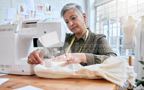 Image of Tailor, senior woman and sewing machine for clothes fabric, luxury apparel or creative design in studio workshop atelier. Startup small business designer, service and sewer working on fashion outfit