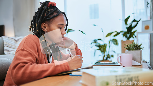 Image of Studying, student and black woman writing in notebook for education, learning and notes for academic class. University, college and girl focus, busy and thinking for homework, assignment and project