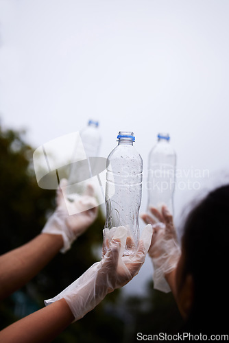 Image of Bottle cleaning, sky and people hands recycle plastic garbage or pollution for volunteer environment support. Community help mockup, NGO charity or eco friendly team helping with nature park clean up