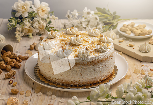 Image of Cake with whipped cream and nuts