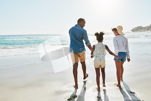 Image of Black family, beach and walk during summer on vacation or holiday relaxing and enjoying peaceful scenery at the ocean. Sea, water and parents with daughter, child or kid with childhood freedom