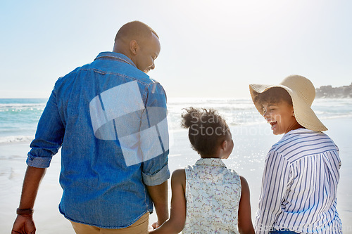 Image of Black family, beach and walking during summer on vacation or happy holiday laughing and enjoying the scenery at the ocean. Sea, water and parents with daughter, child or kid with childhood freedom
