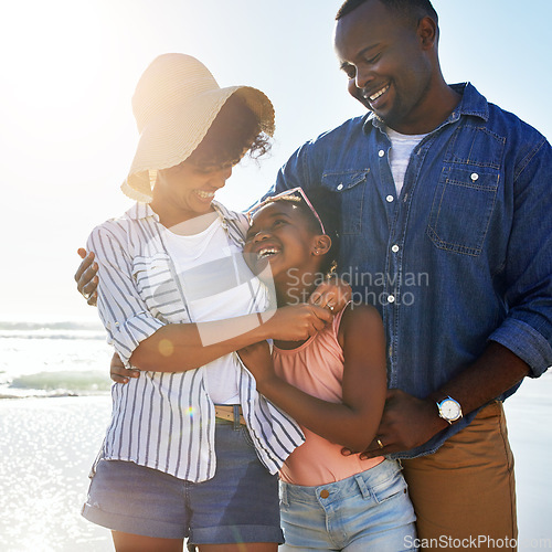 Image of Smile, hug and happy with black family at beach for summer break, support and tropical vacation. Peace, travel and happiness with parents and daughter playing by the ocean for freedom, sea and care