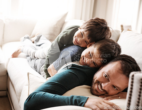 Image of Happy family, father bonding with children and relax on sofa for love, care and smile at home together. People, dad and kids lying on couch in the living room for cozy winter hug or fun with parent