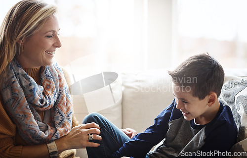 Image of Love, mother and son on couch, playing and bonding on weekend, loving and tickling in living room. Mama, family and male child with mom, playful and cheerful on break, laughing together and happiness
